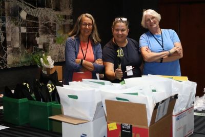 Linnea, Michelle, Kris at the registration table.